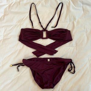 Burgundy/wine Perry Ellis bikini with beaded ties. Size small, never worn.